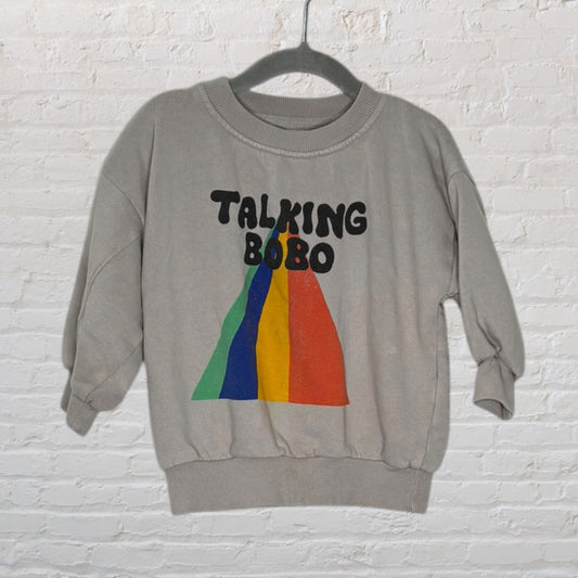 Gray sweatshirt with 'Talking Bobo' text and a colorful graphic, displayed on a hanger.