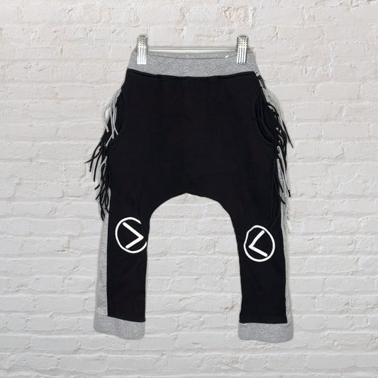 Black harem pants with grey waistband and cuffs, featuring fringe sides and knee graphics.