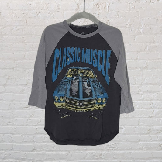 Raglan sleeve tee with 'Classic Muscle' graphic featuring a vintage muscle car in blue and yellow on a black and grey shirt.