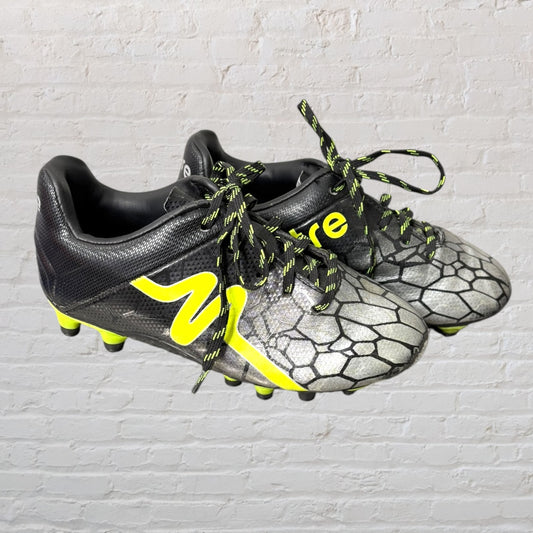 Black and neon yellow soccer cleats with graphic pattern and matching laces.