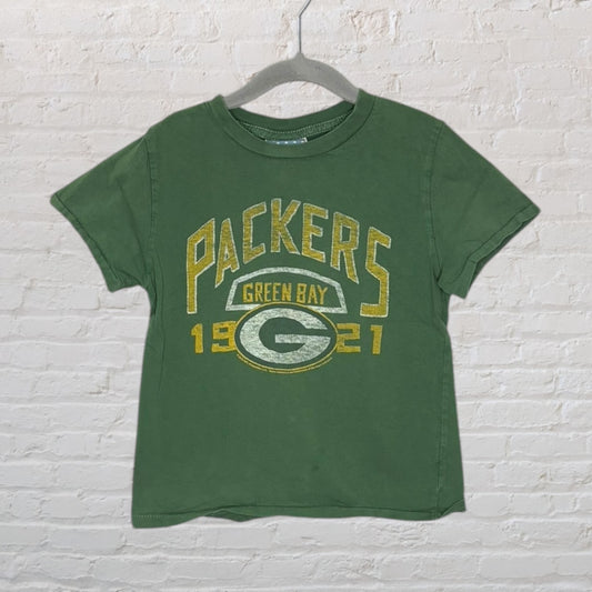 Green T-shirt with Green Bay Packers 1921 logo and graphics in yellow and white, displayed on a hanger.